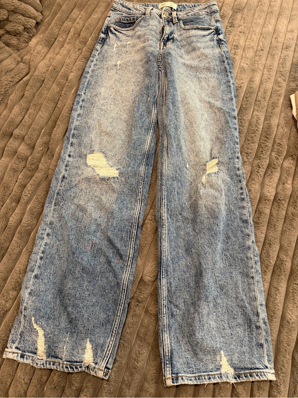 Buckle Light Wash Distressed Wide Leg Jeans
